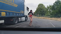 Arab whore dancing topless in front of truck