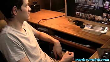 Young twink jerks off his dick and cums while watching porn